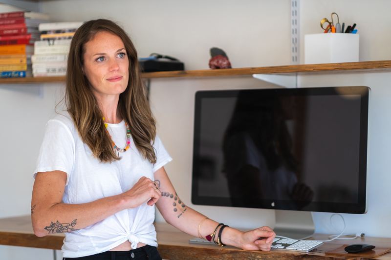 Paige Hewlett at her desk